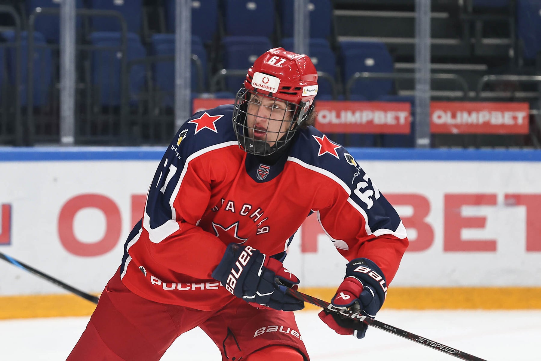 Hockey prospect skating in red